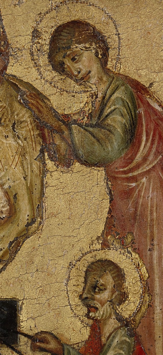 His downward gaze and careful posture highlight the shared burden and solemnity of the moment.