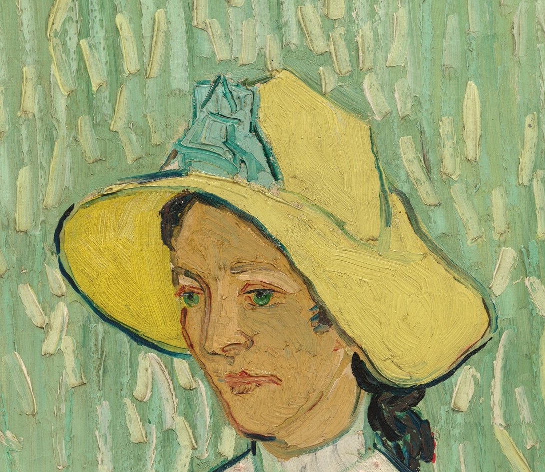 A sun-bleached halo of yellow that frames the face and draws the eye first; its tilt adds subtle tension.