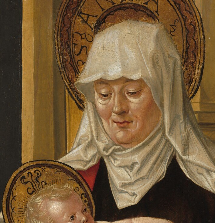 Her tender, slightly melancholic gaze carries the emotional weight of the grandmother who knows the future of the child.