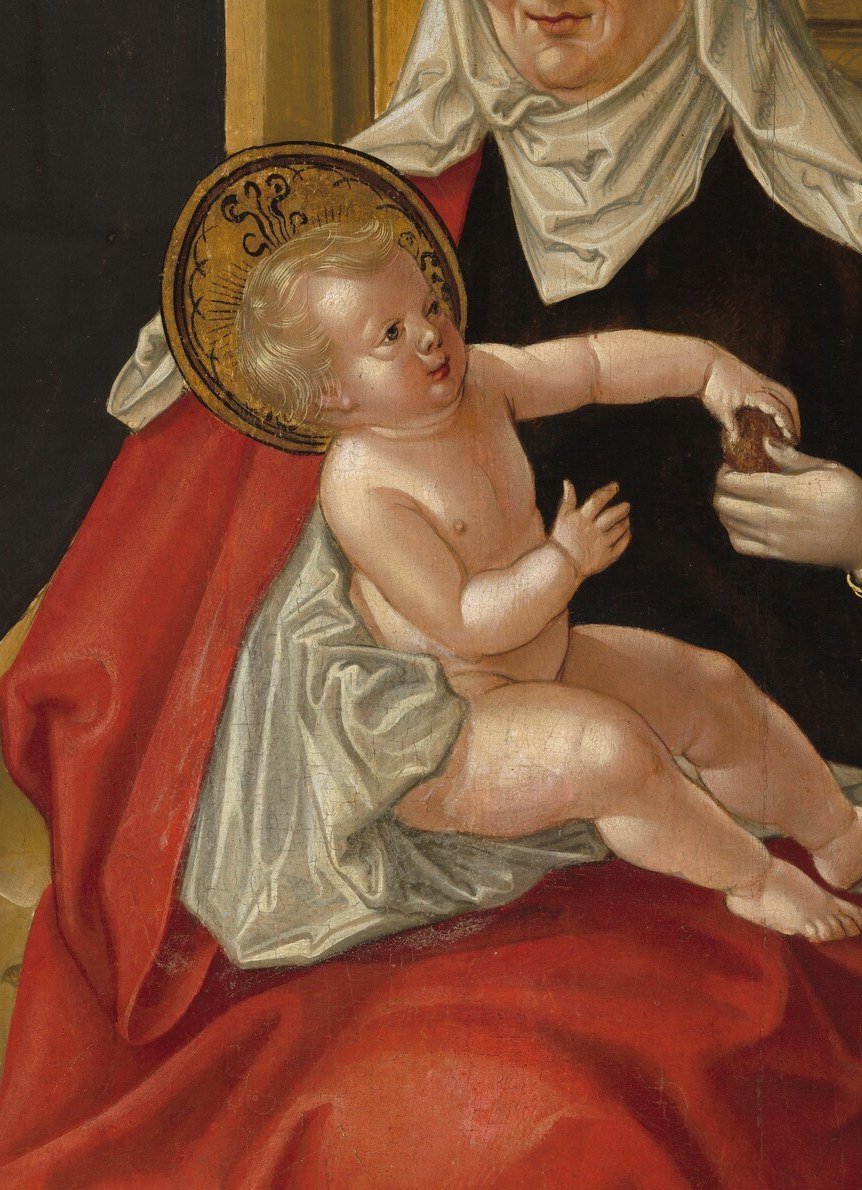 His gesture directs us to the Christ Child in his mother's hands.