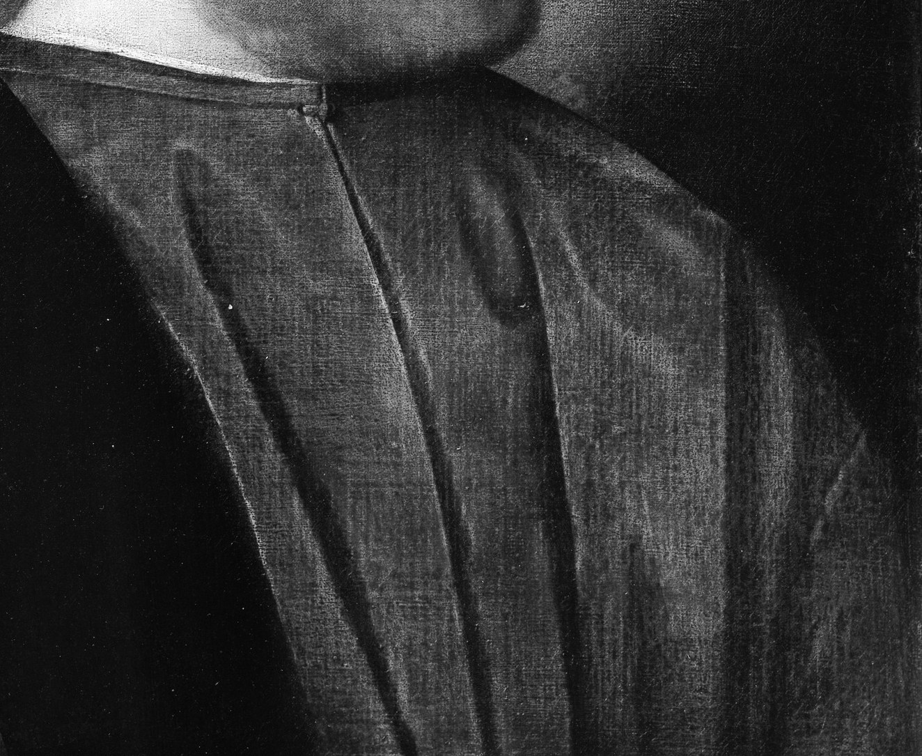 The simple, dark robe emphasizes his gravitas, not his wealth.