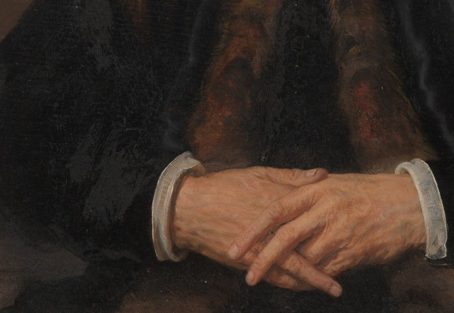 The hands anchor the composition below; the classic Protestant devotional posture adds solemnity, while aged knuckles and thinning skin give documentary weight