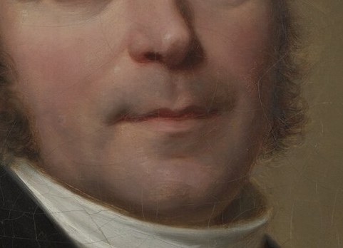 His cravat is a sharp white contrast.
