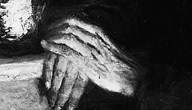 His folded hands suggest a deep tension.