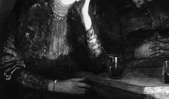 Her dress seems to glow in the dim light.