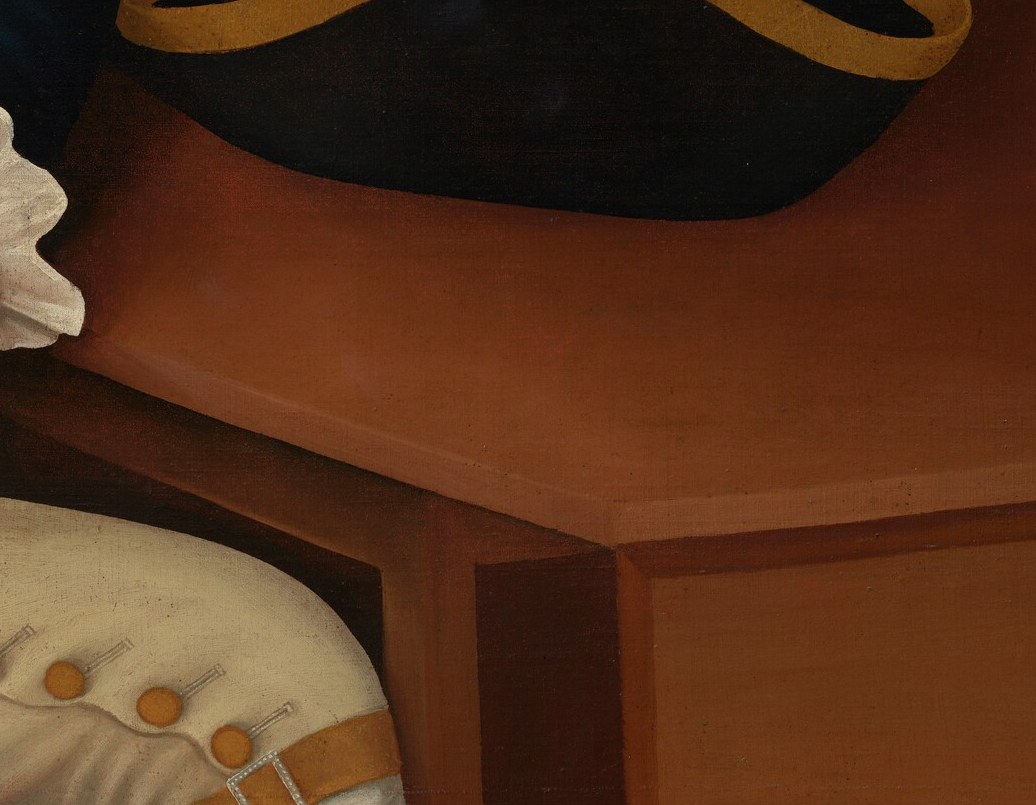 His hat waits on the table. He does not need to wear it.