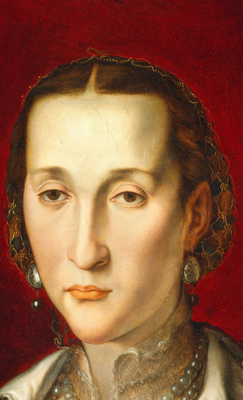 Bronzino paints her like a statue.