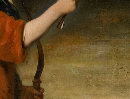 The boy on the left smiles, holding a bow.