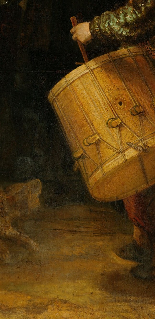 His energetic posture and the large drum add to the sense of movement and anticipation.