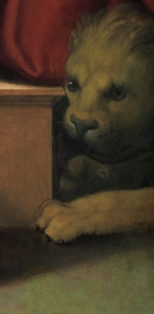 But even closer: a small lion guards his feet.