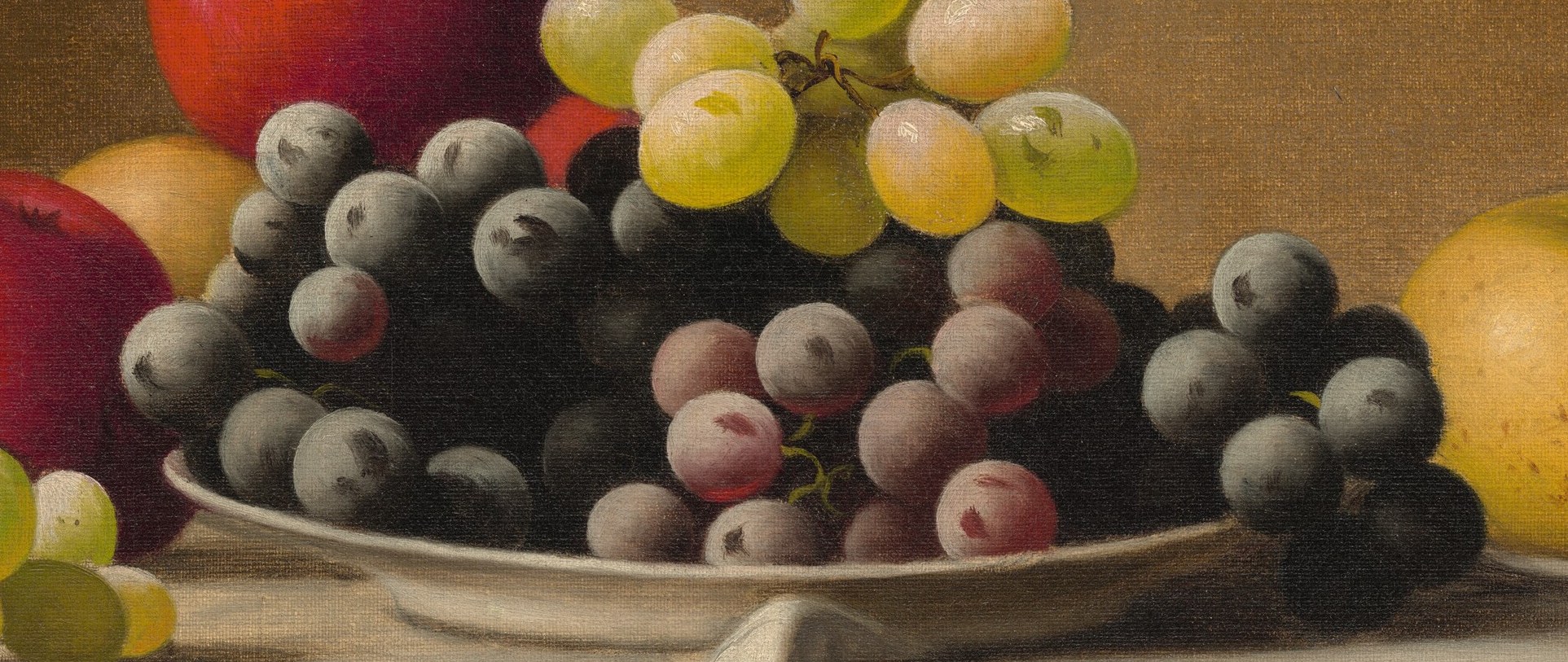 The deep, rich color and varied shapes of these grapes convey a sense of fullness and depth.