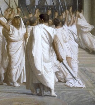 Brutus walks away, sword still raised.