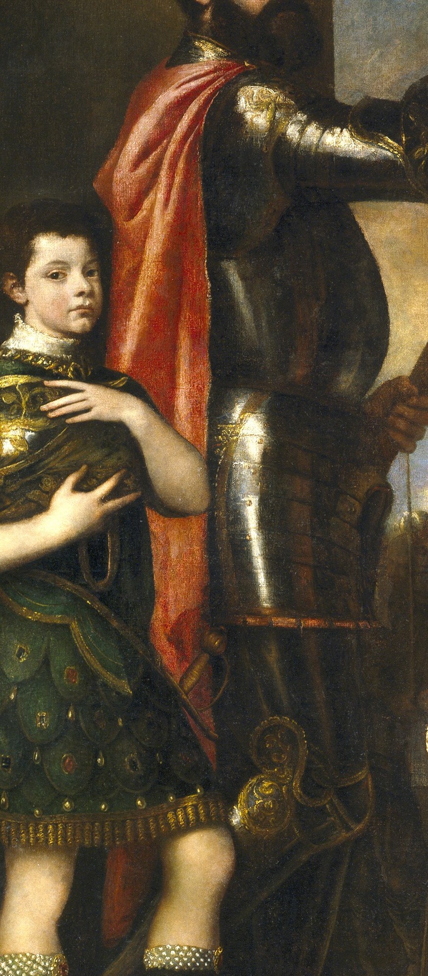 Look at the boy holding his helmet.