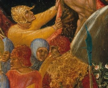 In the center, Judas embraces Christ.