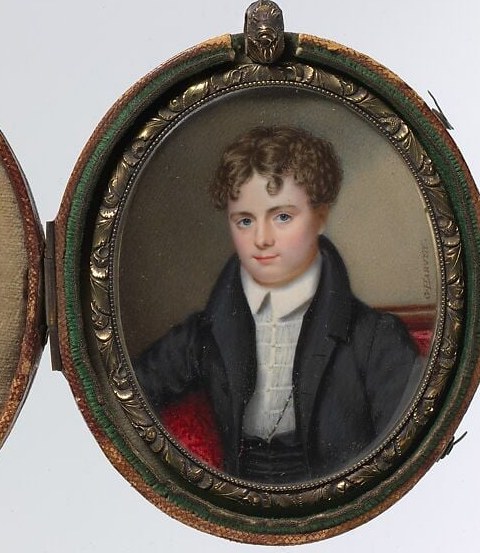The intricate detailing of the frame suggests the value and preciousness of the miniature portrait.