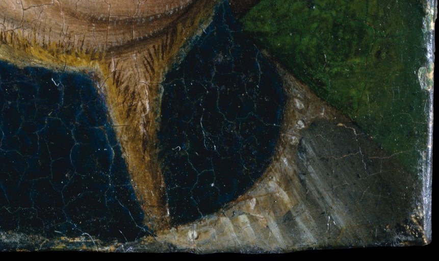 His short beard and dark garment suggest a man of standing.