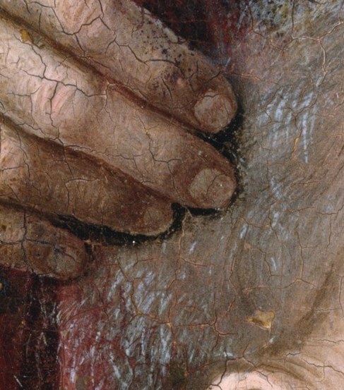 A mysterious hand rests on his head, possibly a blessing.
