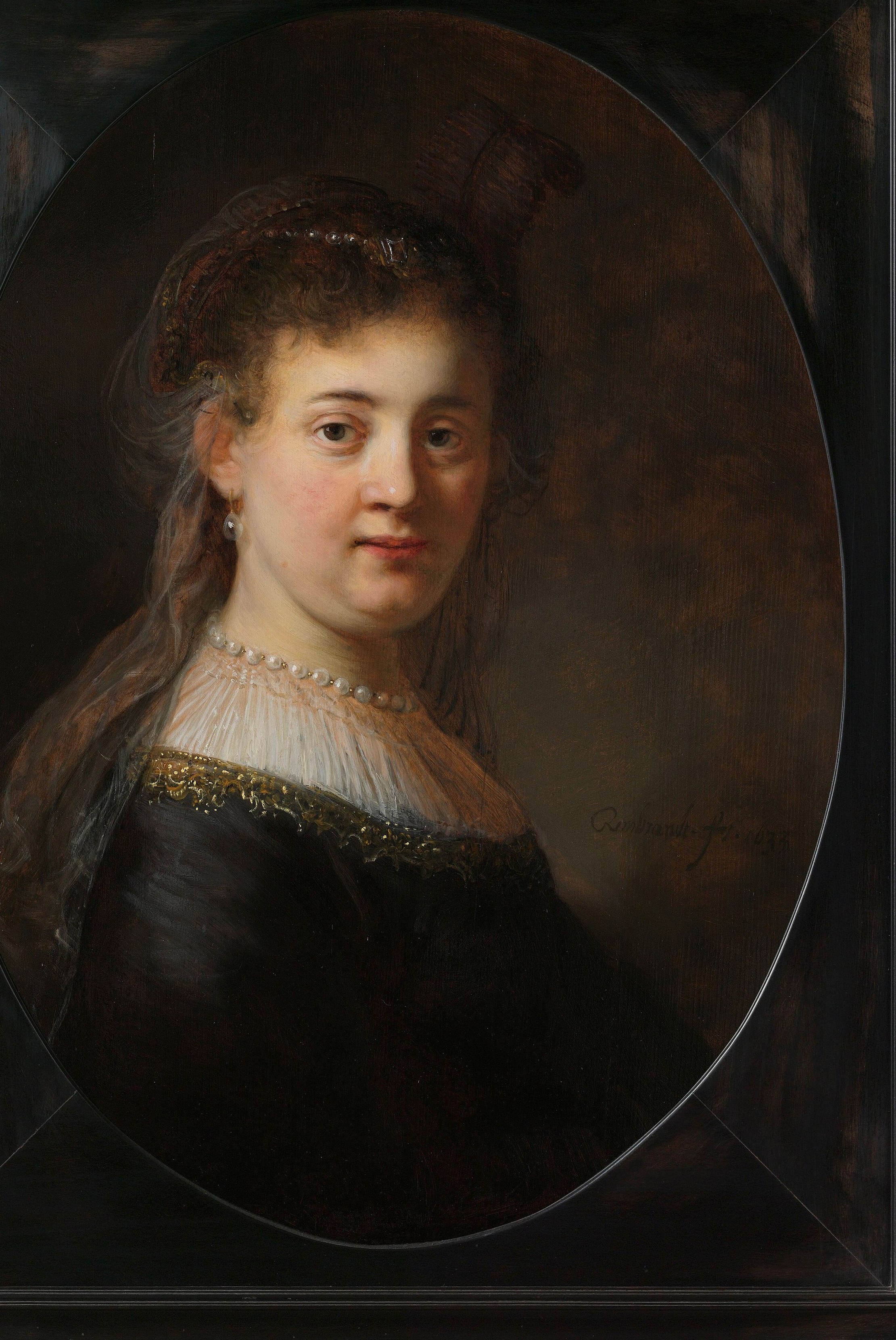 The implied oval frame directs the viewer's focus and adds a classical element to the composition.