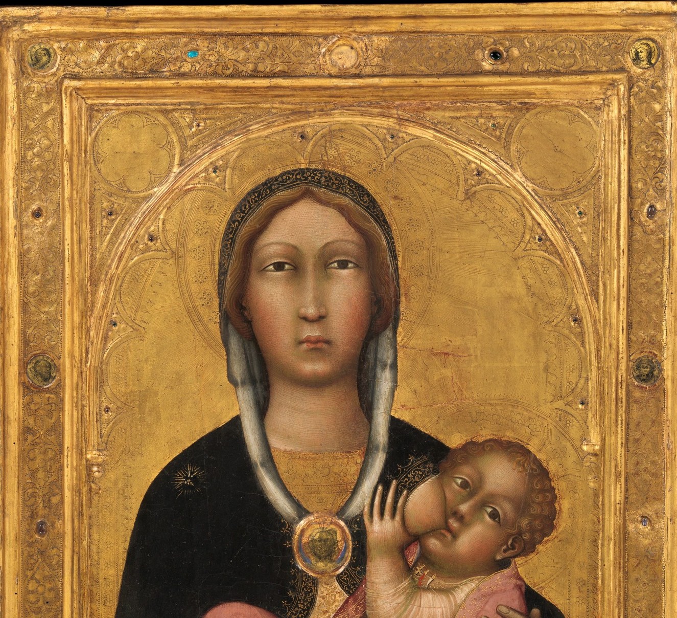 The gold leaf is worked with a punch to create repeating floral/geometric micro-patterns , a labor-intensive step invisible in low-res reproductions but richly tactile up close; signals the painting's devotional value.