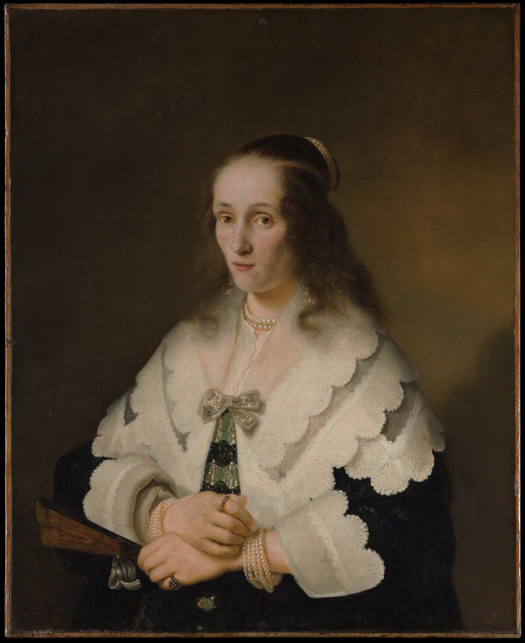 The deep, almost featureless background isolates the figure, focusing all attention on her presence and attire.
