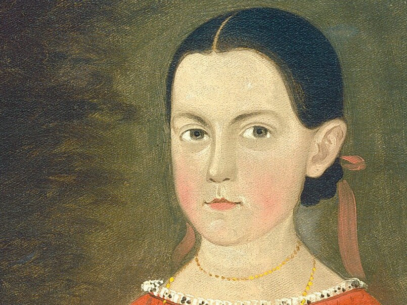 Her steady gaze suggests thoughtfulness and quiet strength.