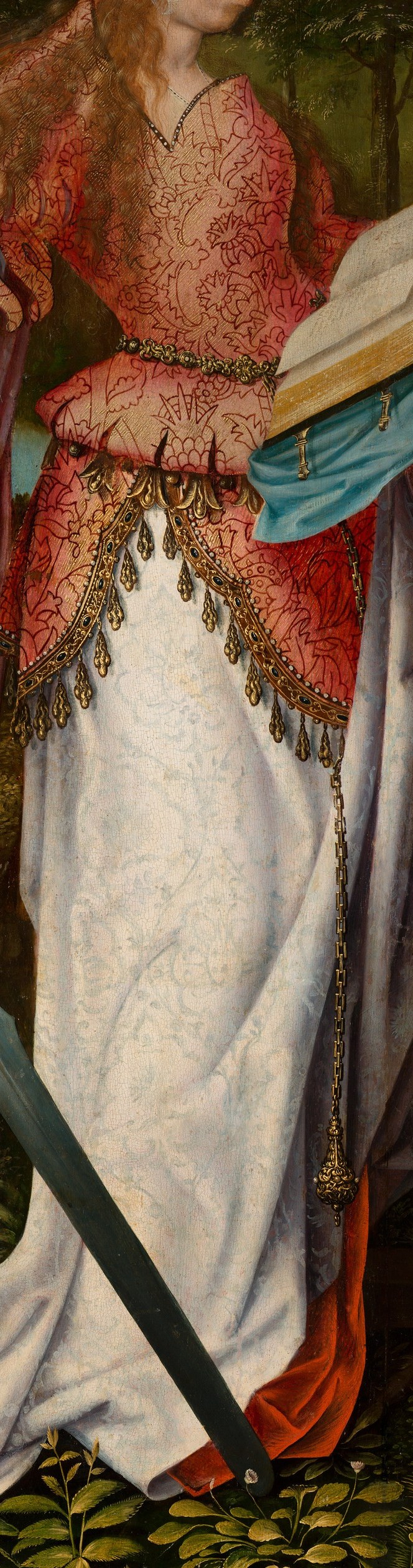 Saint Catherine is in a luxurious gown, holding a book and sword.