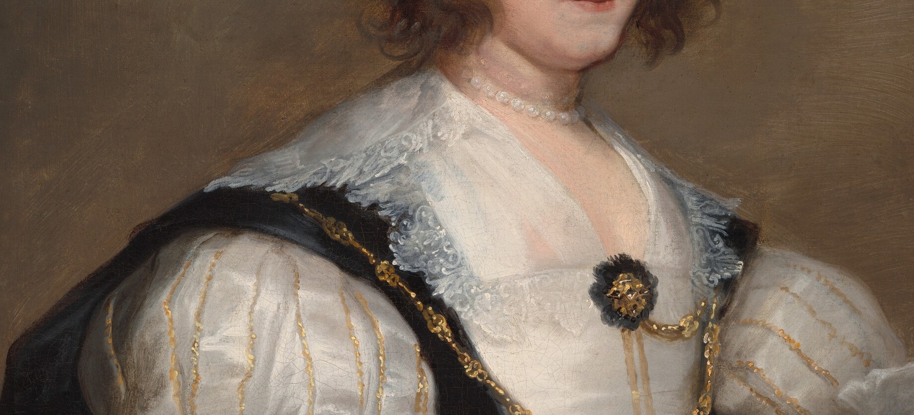The elaborate lace signals extreme wealth and fashion-forwardness , point lace of this scale was worth more per ounce than gold in 1628.