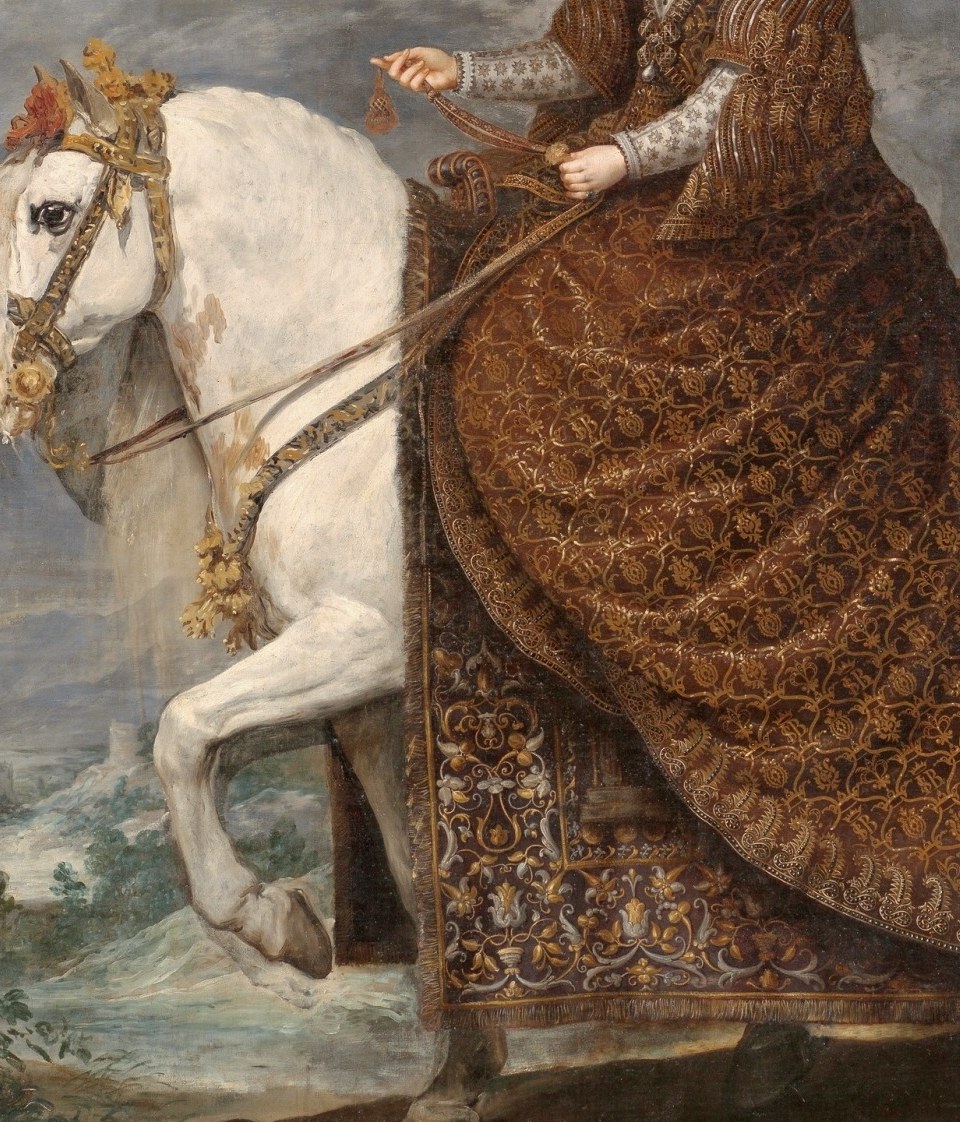 She rides a powerful white horse.
