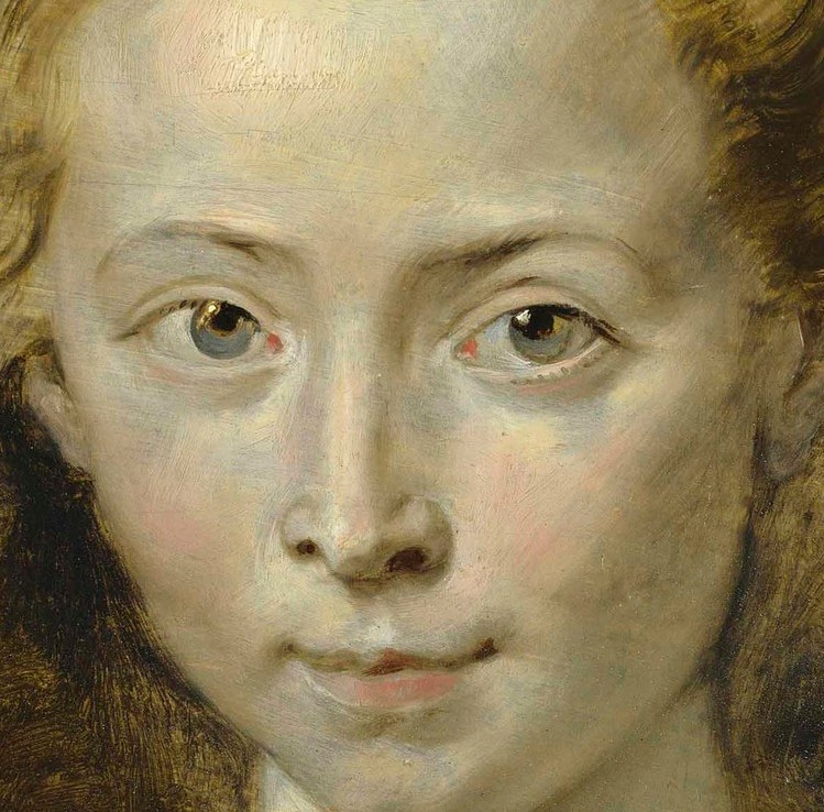 Her calm, attentive gaze suggests youthful innocence.