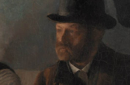 His thoughtful face suggests a moment of reflection or deep concentration.