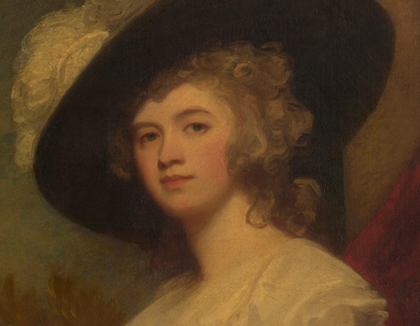 Her wide-brimmed black hat, with its feather, was also fashionable.
