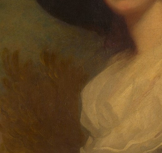 Her dress, with its voluminous puffed sleeves, was very much in style.