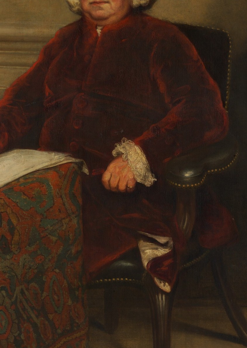 His red velvet coat shows his wealth and importance.