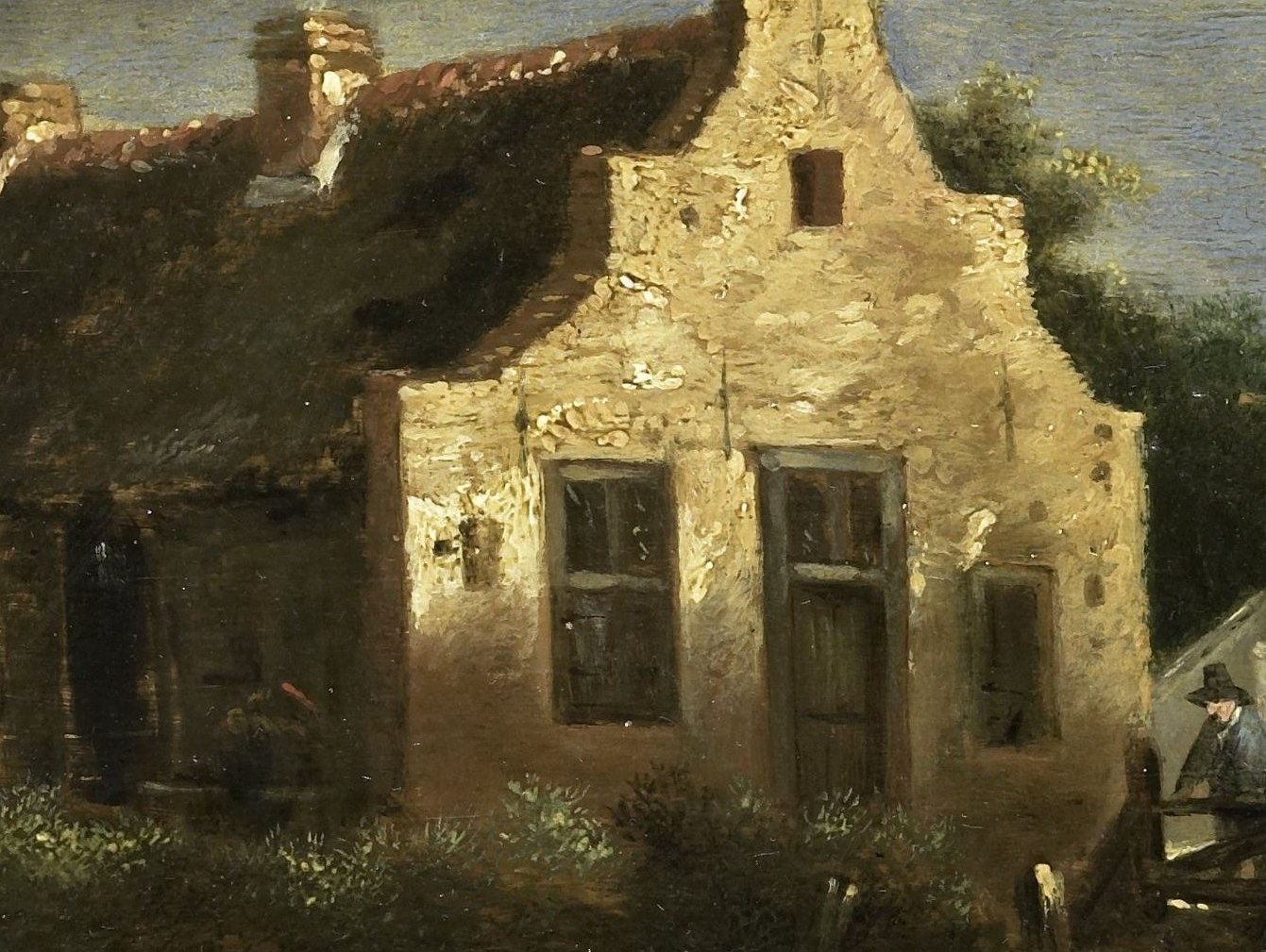The textured, crumbling plaster suggests age and exposure to the elements, conveying a sense of enduring rural life.