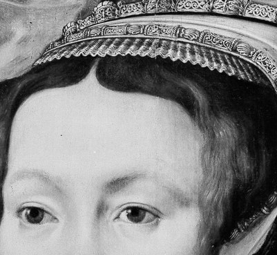 The elaborate headdress signifies her status.