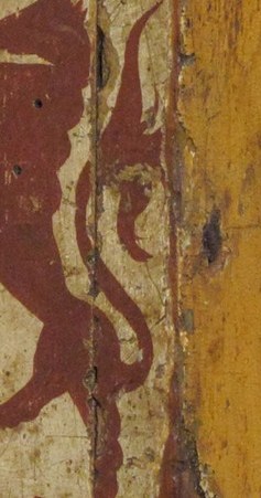 A heraldic symbol on the left margin, hinting at lineage or affiliation, adding a layer of historical context.