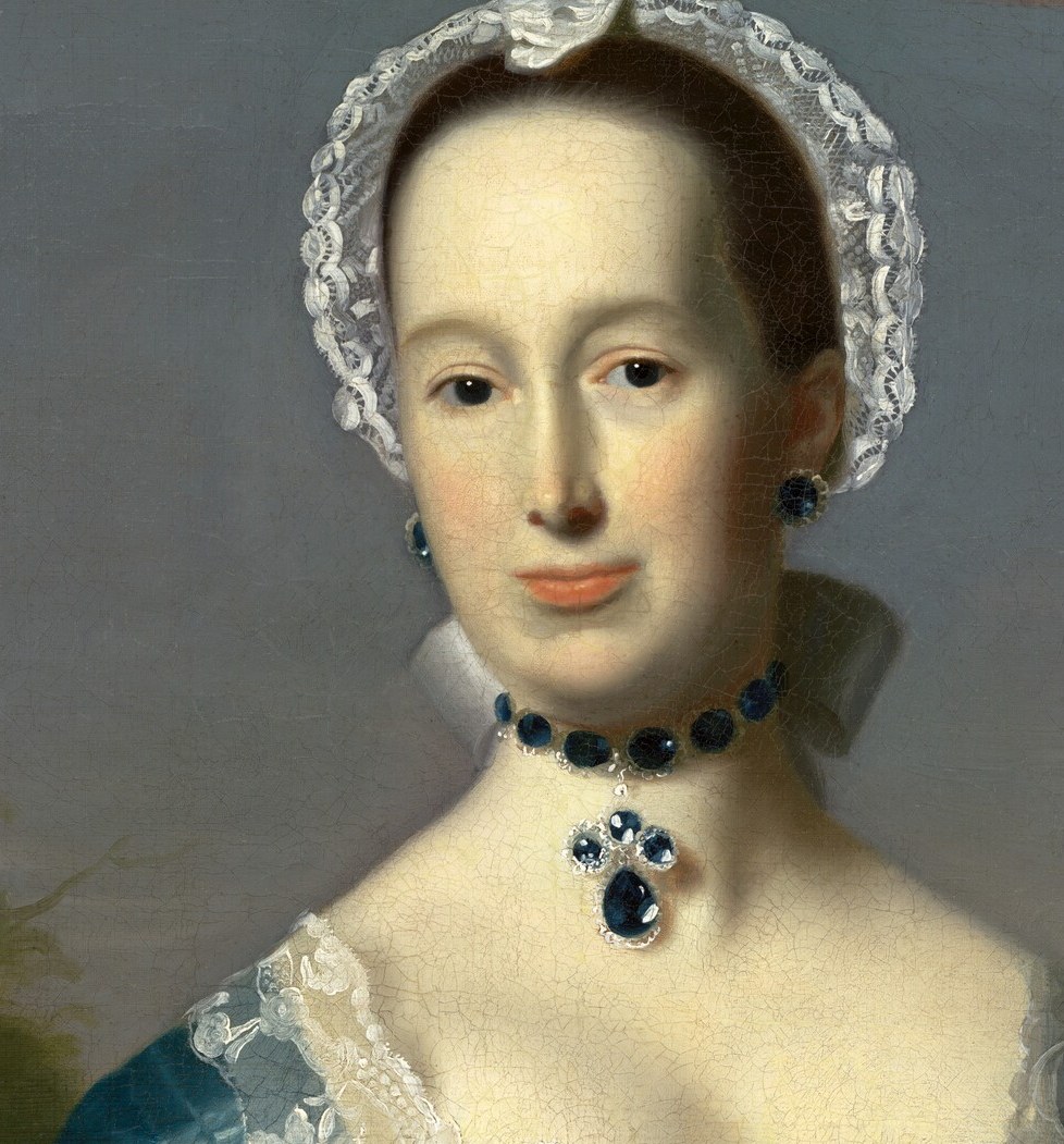 Her direct gaze and serene expression convey a sense of quiet confidence and social standing.
