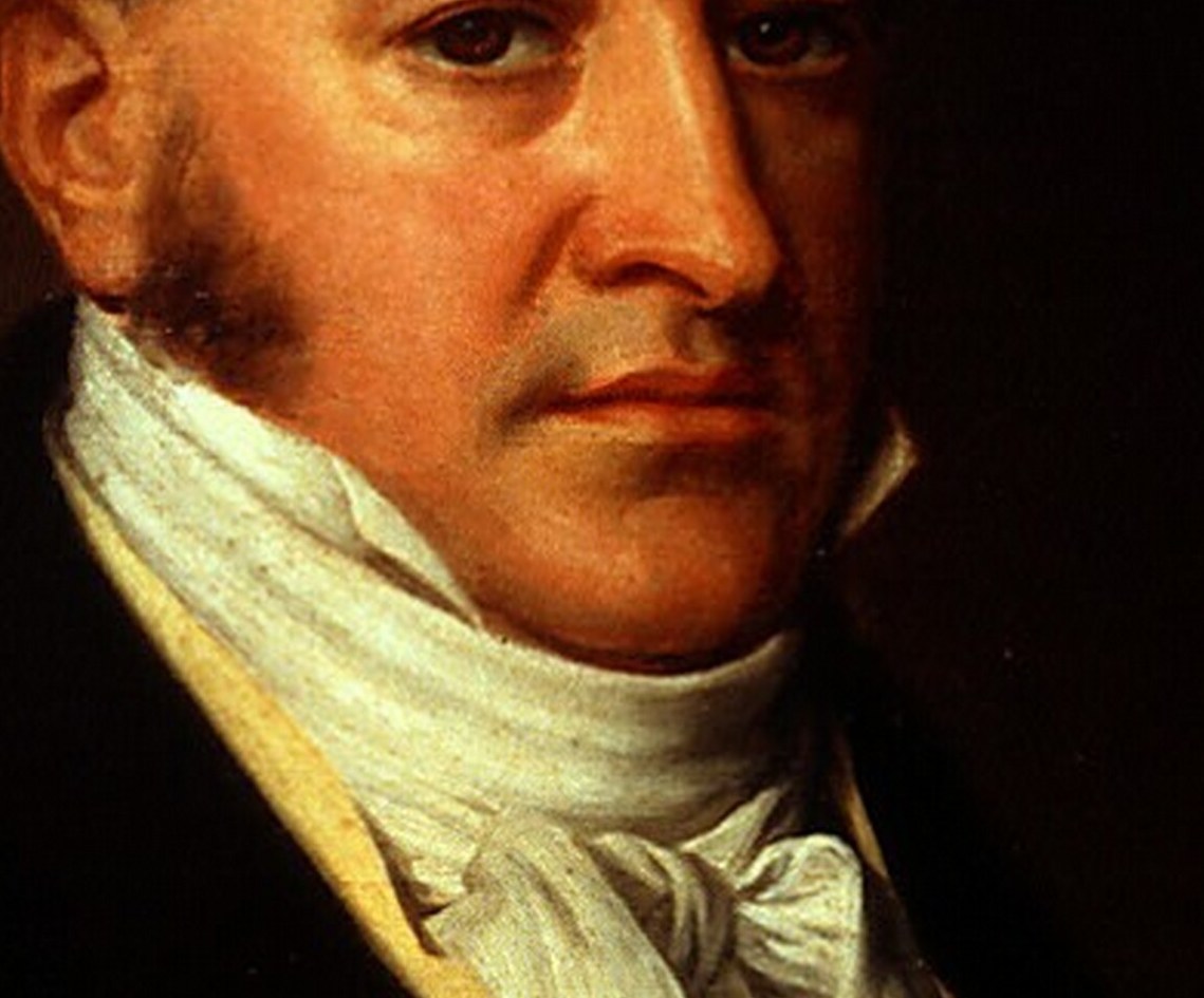 The crisp white cravat, tied with a prominent knot, is a focal point of his attire and a testament to the era's fashion.