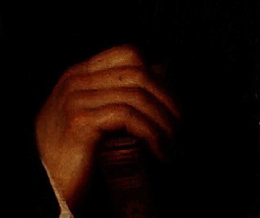 His hand, delicately painted, suggests a man of refined composure.