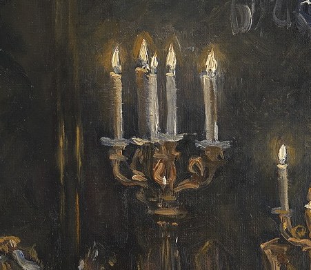 The flickering candlelight creates an intimate, quiet atmosphere.