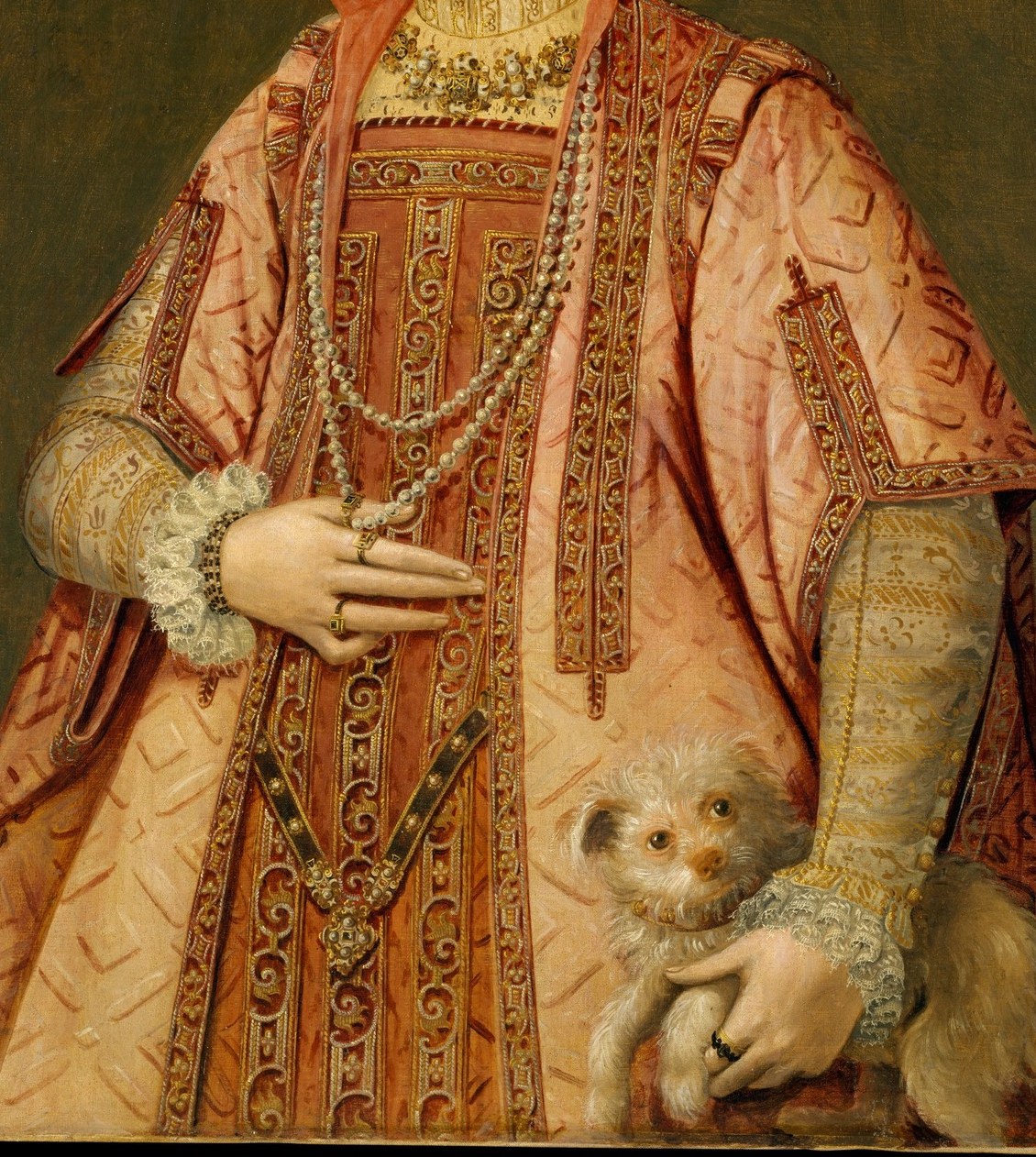 Her dress, embroidered with gold, confirms her high social standing.