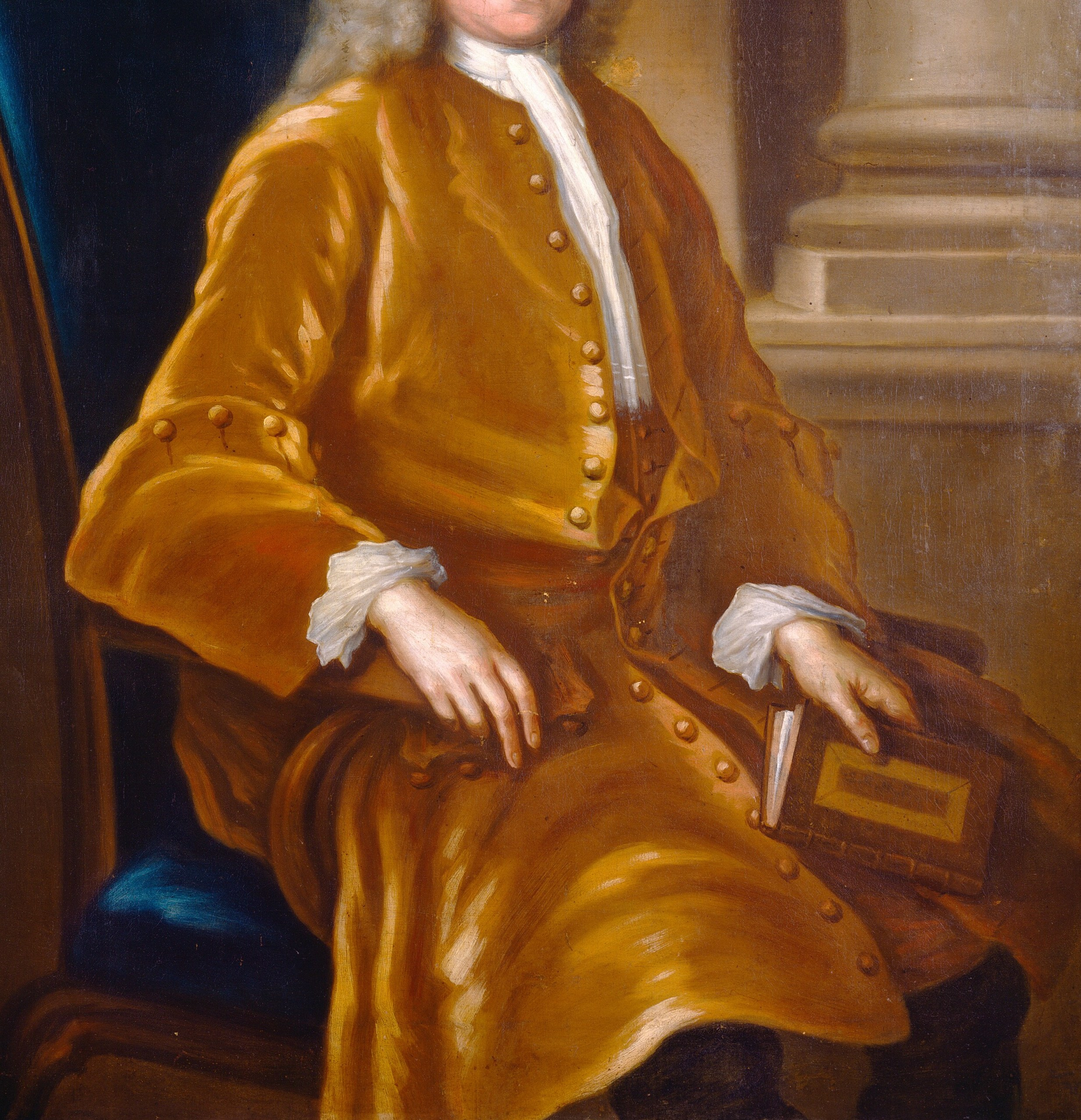 His golden coat and cravat declare his status.