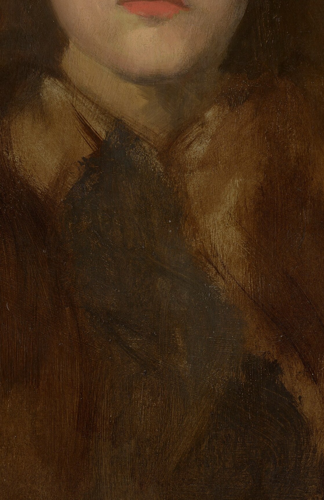 Look closely at her dark garment, near her shoulder.