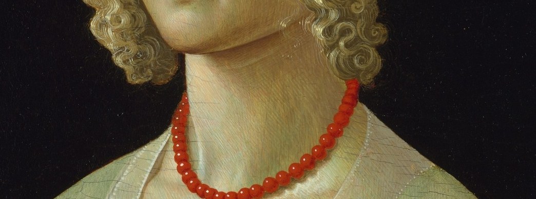 Her family chose a red coral necklace.