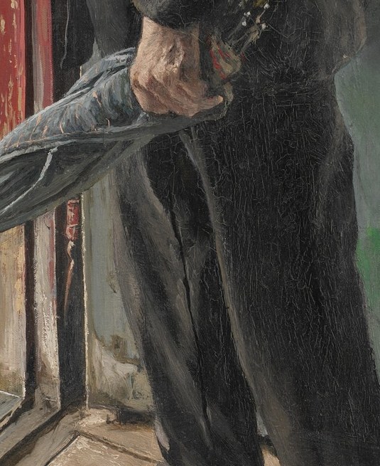 The rain has stopped, but he still holds his umbrella.