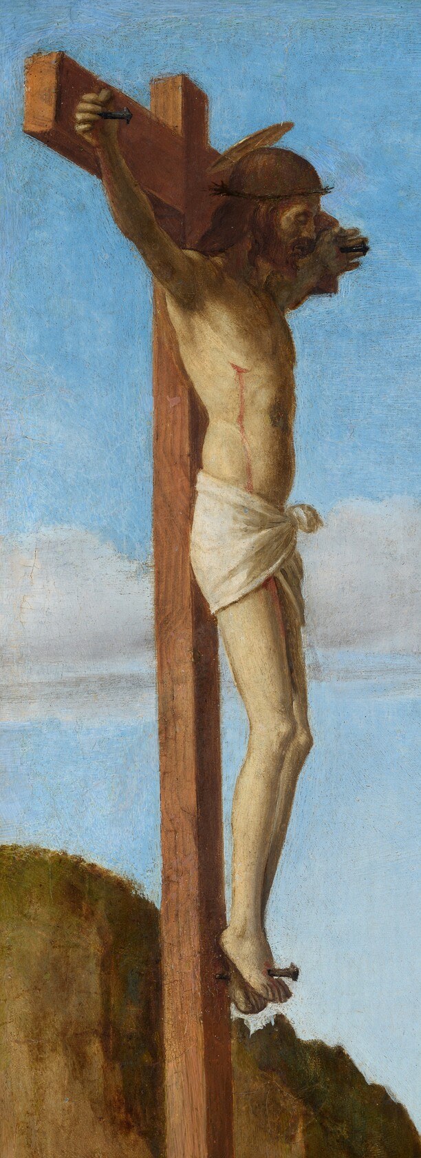 A silent witness to Jerome's penitence, the corpus in a loincloth anchors the left margin with devotional weight.