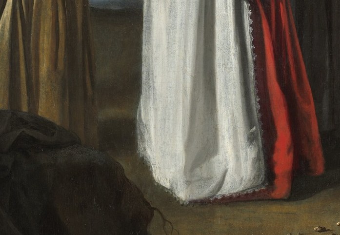 Look at the central woman's vibrant red sash.