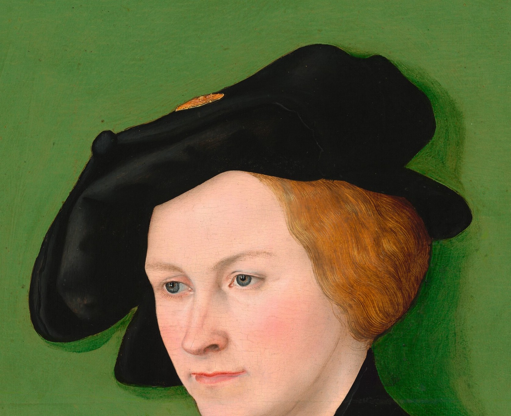 She wears a fashionable German beret, signaling her status.