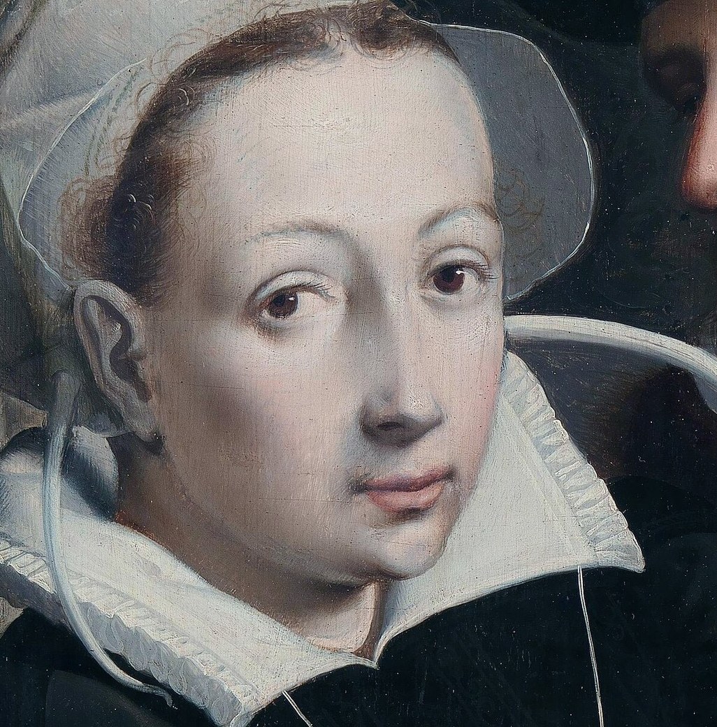 Her direct gaze and pale skin convey a sense of quiet introspection or perhaps apprehension.