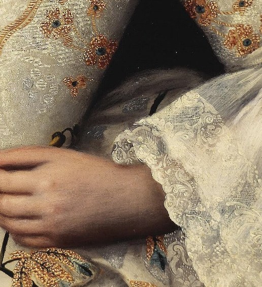 This intricate lace was very costly, adding to her prestige.